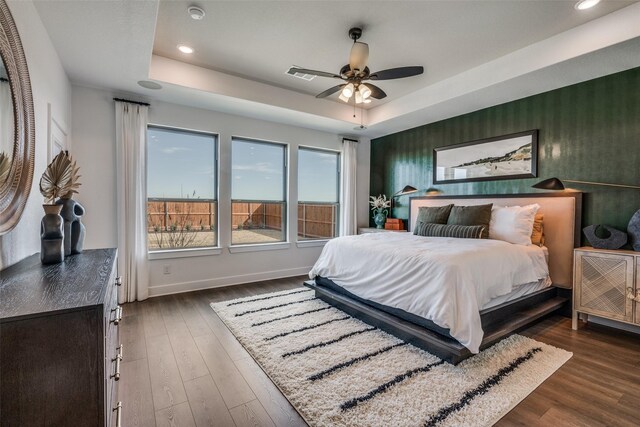 1887 Silver Birch Rd, Waxahachie, TX 75165 - bedroom featuring a raised ceiling, recessed lighting, wood finished floors, and a ceiling fan