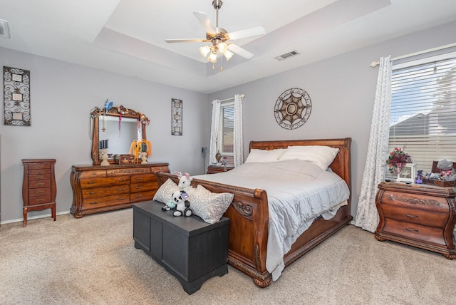 2715 Forest Lake Dr, Grand Prairie, TX 75052 - bedroom with light carpet, multiple windows, a raised ceiling, and ceiling fan