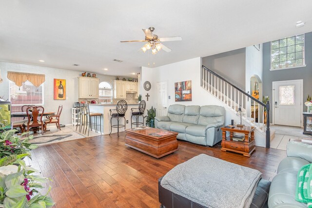 2715 Forest Lake Dr, Grand Prairie, TX 75052 - living room featuring stairs, light wood-style floors, a ceiling fan, healthy amount of natural light, and recessed lighting