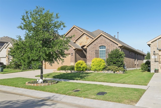 8901 Thompson Rd, Argyle, TX 76226 - view of front of home featuring brick siding, driveway, and a front lawn