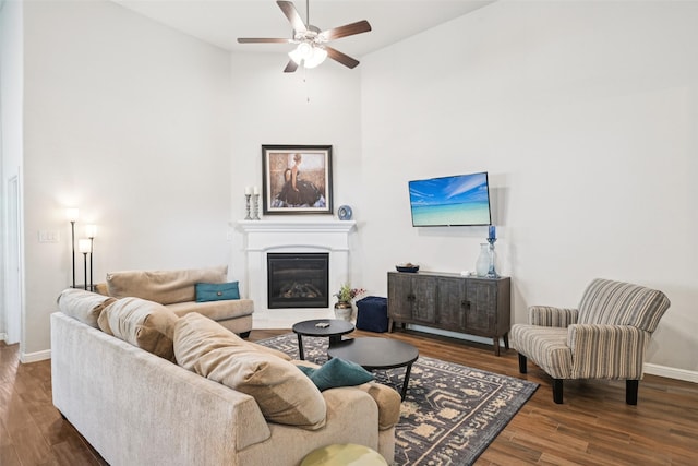 8901 Thompson Rd, Argyle, TX 76226 - living area with ceiling fan, wood finished floors, a glass covered fireplace, and high vaulted ceiling