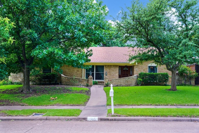 315 Ridgewood Dr, Richardson, TX 75080 - view of front of property featuring brick siding and a front lawn