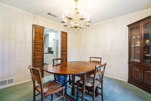 315 Ridgewood Dr, Richardson, TX 75080 - dining space featuring wallpapered walls, a chandelier, carpet floors, a textured ceiling, and crown molding