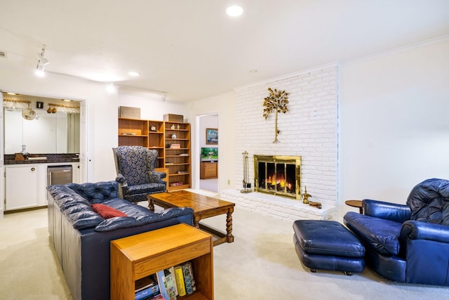 315 Ridgewood Dr, Richardson, TX 75080 - living area with light colored carpet, ornamental molding, a fireplace, and recessed lighting