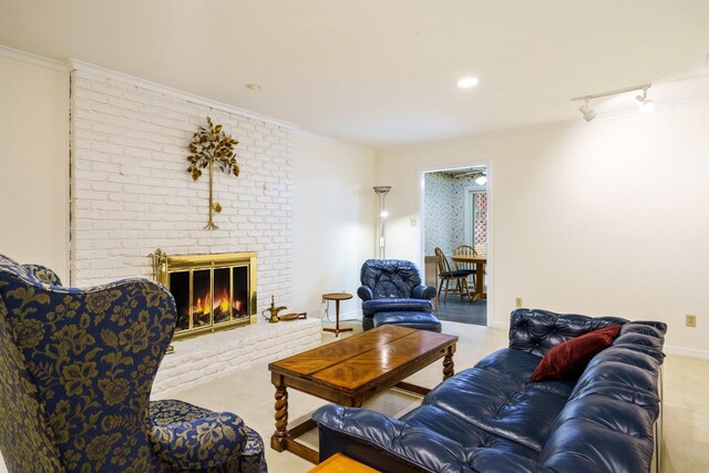 315 Ridgewood Dr, Richardson, TX 75080 - carpeted living area featuring crown molding, a fireplace, and track lighting