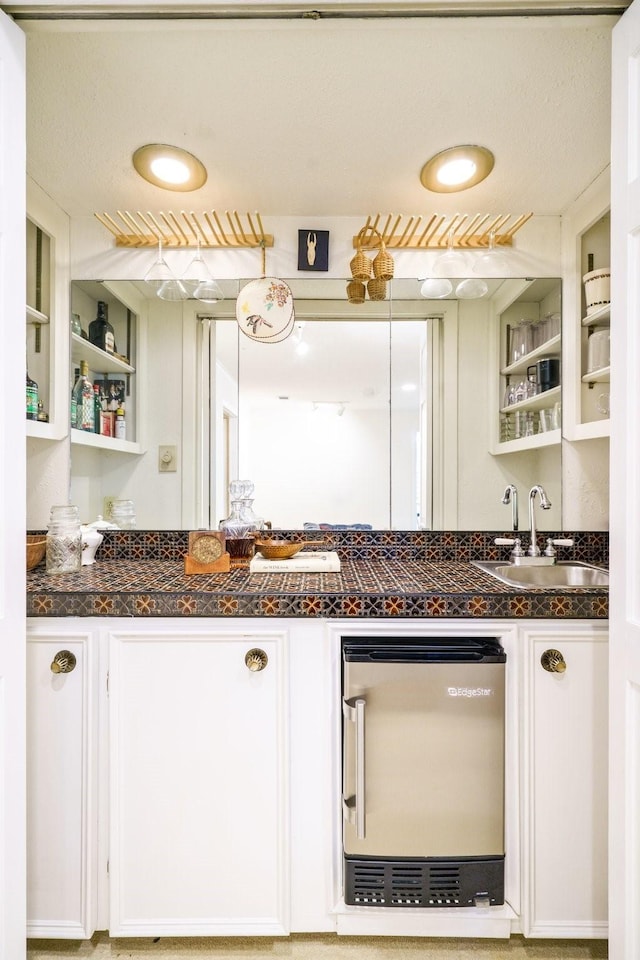 315 Ridgewood Dr, Richardson, TX 75080 - kitchen with open shelves, white cabinetry, and tile counters