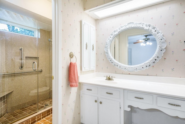 315 Ridgewood Dr, Richardson, TX 75080 - full bathroom featuring wallpapered walls, a stall shower, vanity, and ceiling fan