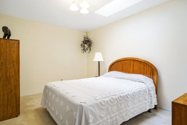 315 Ridgewood Dr, Richardson, TX 75080 - carpeted bedroom with a skylight and baseboards