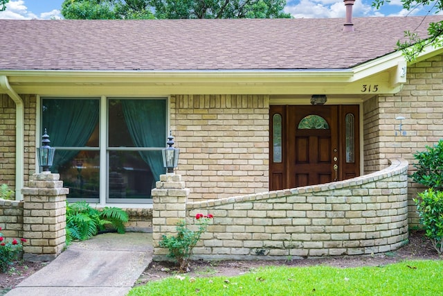 315 Ridgewood Dr, Richardson, TX 75080 - entrance to property with a shingled roof and brick siding