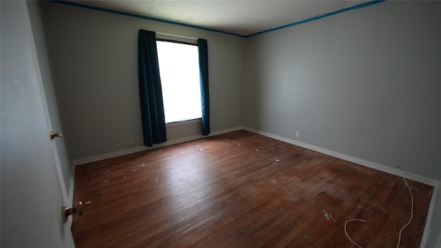 1819 Panhandle St, Denton, TX 76201 - spare room with wood finished floors and ornamental molding