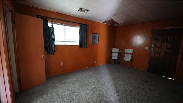 1819 Panhandle St, Denton, TX 76201 - unfurnished room featuring electric panel and wood walls