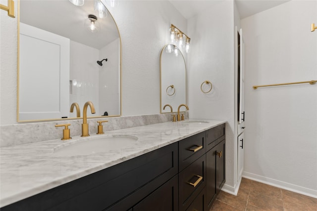 2001 Rey Dr, Woodway, TX 76712 - bathroom with double vanity and baseboards