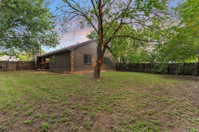 2001 Rey Dr, Woodway, TX 76712 - yard at dusk with a fenced backyard