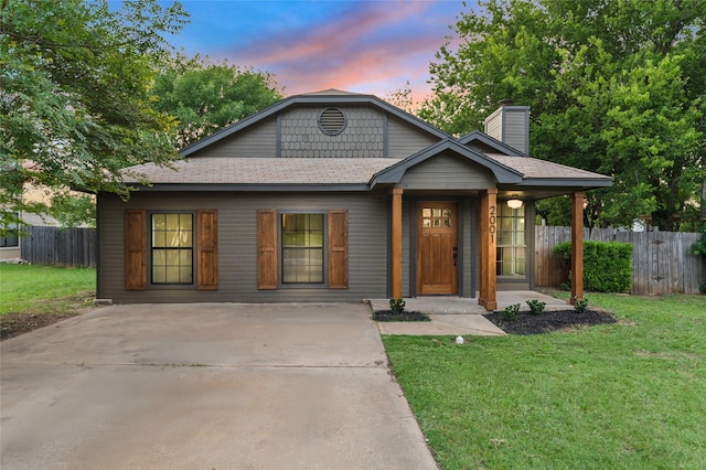2001 Rey Dr, Woodway, TX 76712 - view of front of property with driveway, a chimney, and a shingled roof