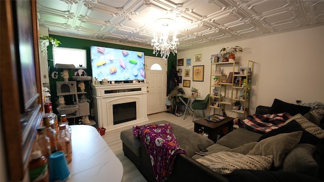 811 Crescent St, Denton, TX 76201 - living room featuring an ornate ceiling, a chandelier, wood finished floors, and a fireplace