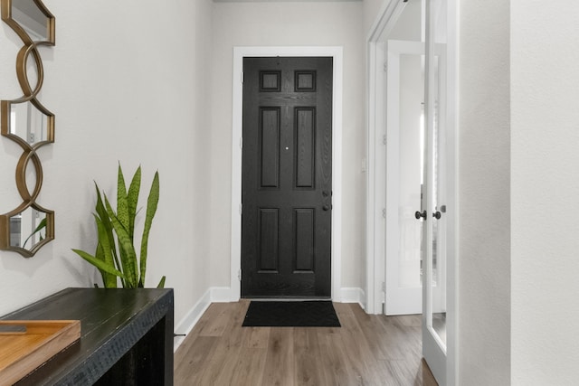 711 Prairie Falcon Dr, Arlington, TX 76005 - foyer entrance featuring wood finished floors and baseboards