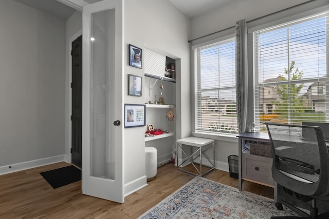 711 Prairie Falcon Dr, Arlington, TX 76005 - office space featuring wood finished floors and plenty of natural light