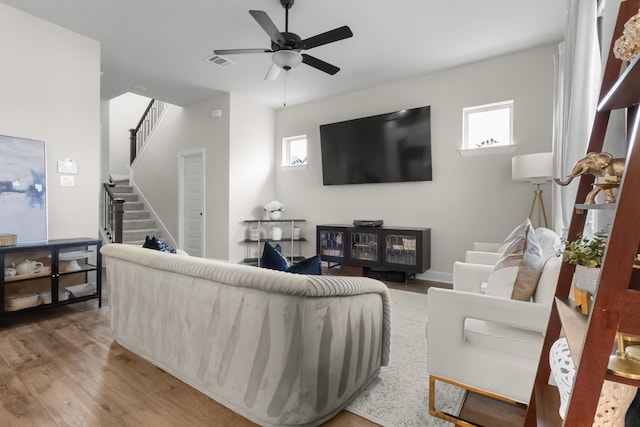 711 Prairie Falcon Dr, Arlington, TX 76005 - living area featuring stairway, light wood-style flooring, and a ceiling fan