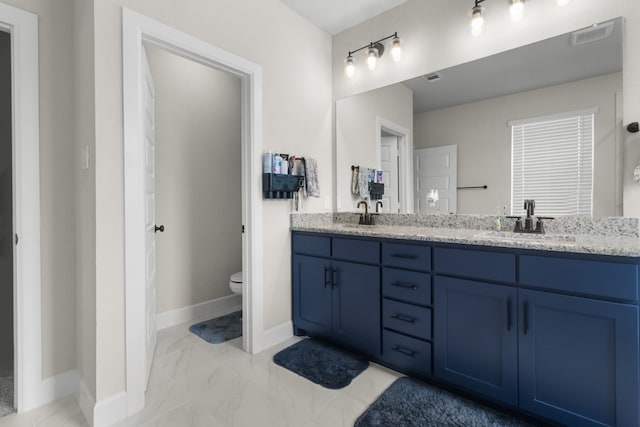 711 Prairie Falcon Dr, Arlington, TX 76005 - bathroom with double vanity and marble look tiles