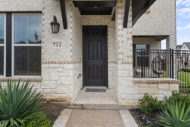 711 Prairie Falcon Dr, Arlington, TX 76005 - doorway to property with stone siding