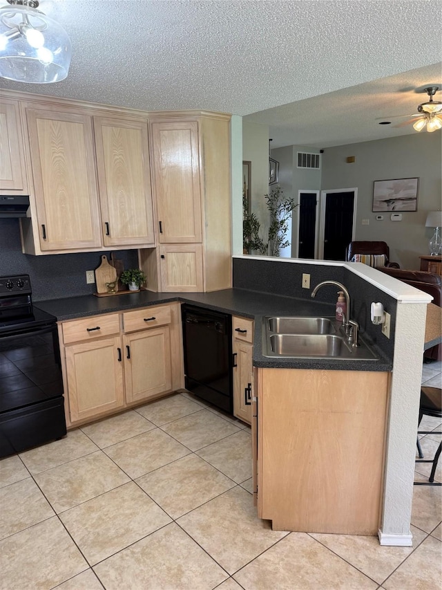 907 Dogwood St, Waco, TX 76706 - kitchen featuring black appliances, light brown cabinets, a peninsula, ventilation hood, and open floor plan