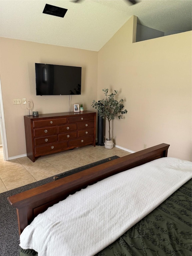 907 Dogwood St, Waco, TX 76706 - bedroom featuring light tile patterned floors and lofted ceiling