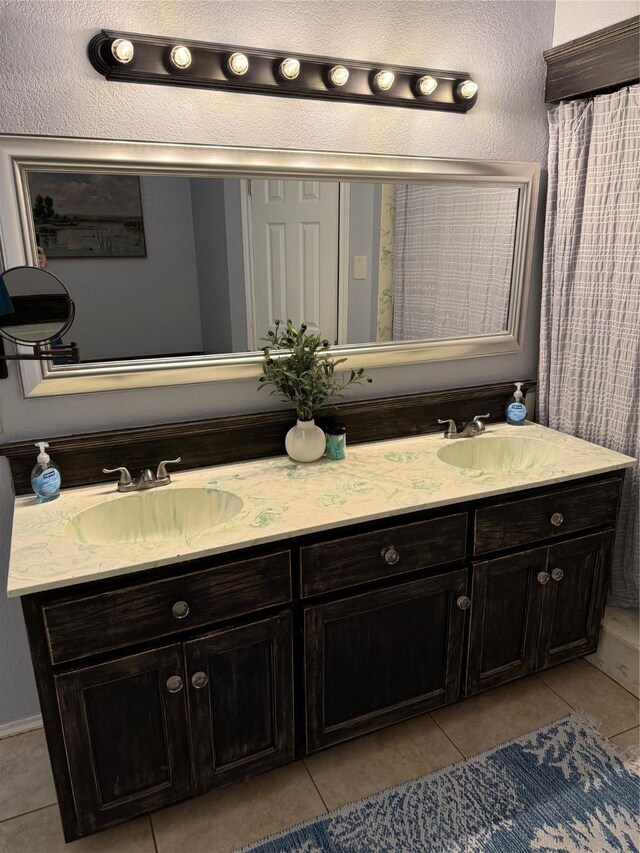 907 Dogwood St, Waco, TX 76706 - full bathroom with tile patterned floors and double vanity