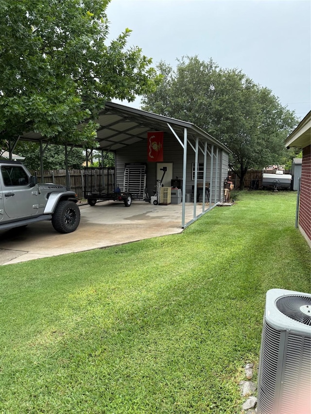 907 Dogwood St, Waco, TX 76706 - view of yard with an attached carport and driveway