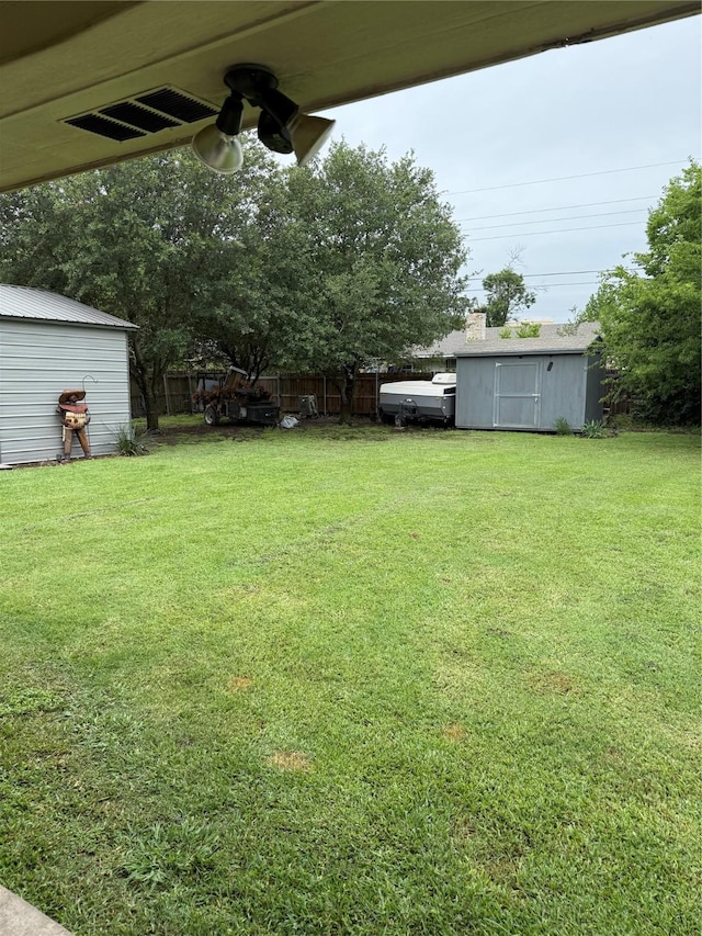 907 Dogwood St, Waco, TX 76706 - view of yard featuring a storage shed and ceiling fan