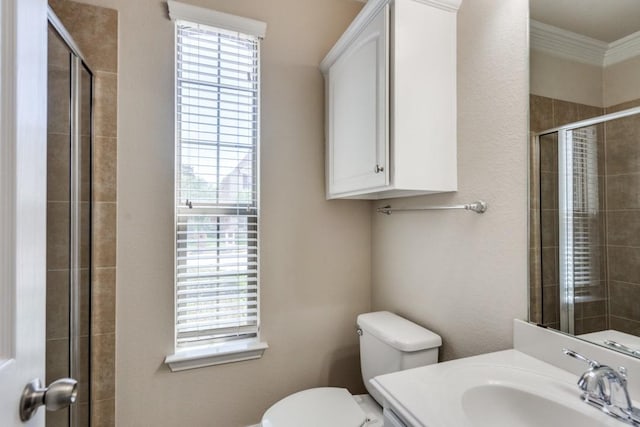 4517 Copeland Dr, Plano, TX 75024 - bathroom featuring plenty of natural light, tiled shower, ornamental molding, and vanity