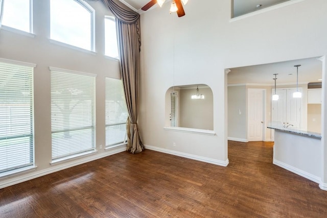4517 Copeland Dr, Plano, TX 75024 - unfurnished living room featuring ceiling fan, a high ceiling, and dark wood finished floors