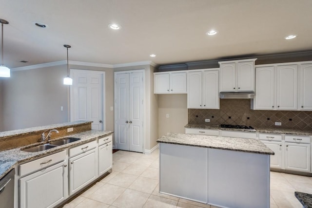 4517 Copeland Dr, Plano, TX 75024 - kitchen featuring under cabinet range hood, ornamental molding, decorative backsplash, light stone counters, and white cabinets