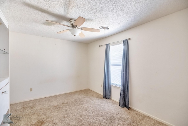 3826 Crest Way, Abilene, TX 79606 - spare room with light carpet, a ceiling fan, and a textured ceiling