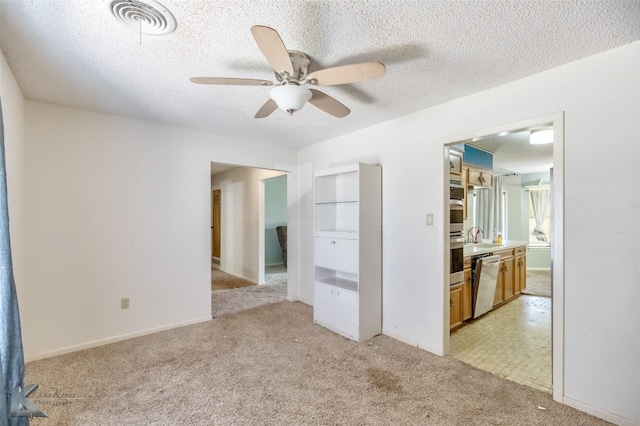 3826 Crest Way, Abilene, TX 79606 - unfurnished room with light colored carpet, a ceiling fan, and a textured ceiling