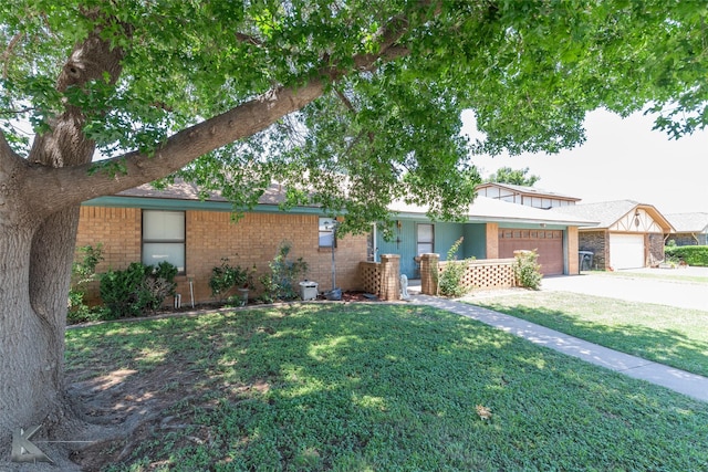 3826 Crest Way, Abilene, TX 79606 - view of front facade with a front lawn, concrete driveway, brick siding, and an attached garage