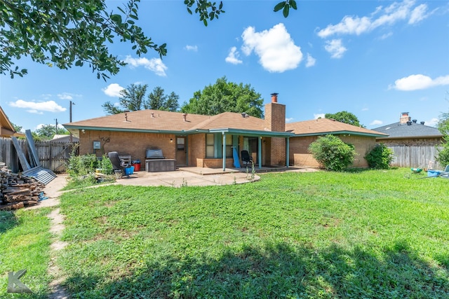 3826 Crest Way, Abilene, TX 79606 - rear view of property with a patio, a chimney, and brick siding