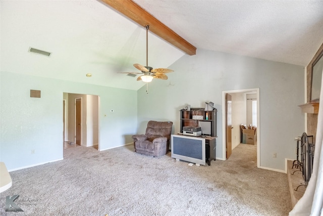 3826 Crest Way, Abilene, TX 79606 - sitting room with beam ceiling, carpet flooring, ceiling fan, a fireplace with raised hearth, and high vaulted ceiling