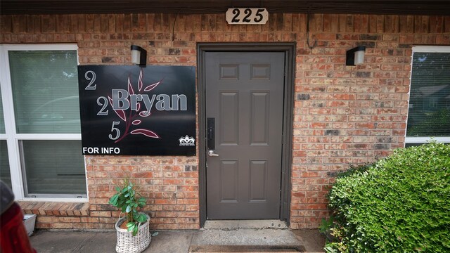 225 Bryan St, Denton, TX 76201 - doorway to property with brick siding