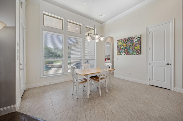 4513 Donnoli Dr, Flower Mound, TX 75022 - dining area with ornamental molding, arched walkways, and a chandelier