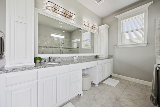 4513 Donnoli Dr, Flower Mound, TX 75022 - full bathroom with a tile shower, double vanity, and marble finish flooring