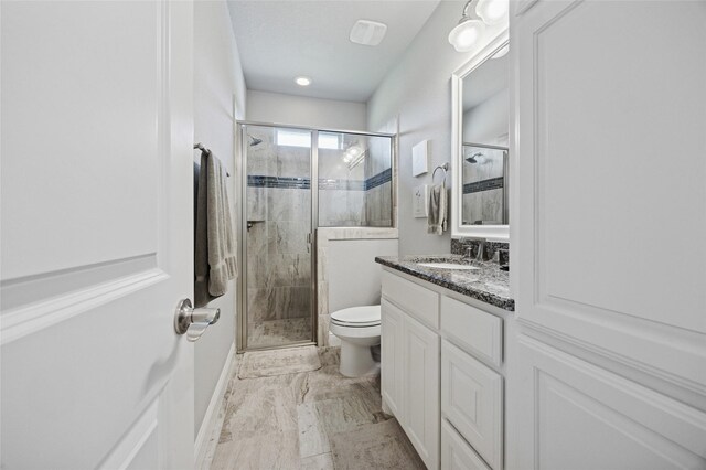 4513 Donnoli Dr, Flower Mound, TX 75022 - bathroom featuring marble finish flooring, a shower stall, and vanity