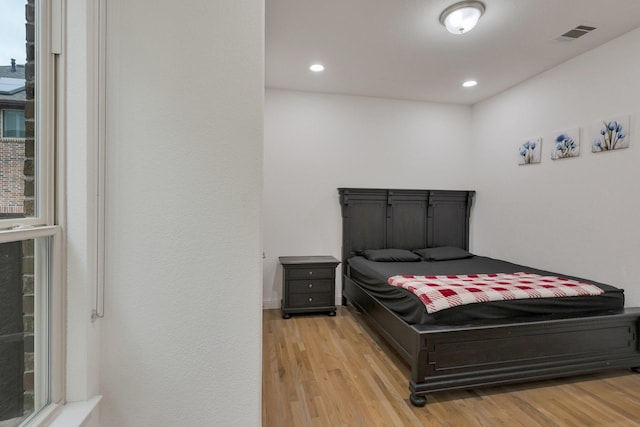2464 Castle Ridge Dr, Richardson, TX 75080 - bedroom with light wood-style floors and recessed lighting