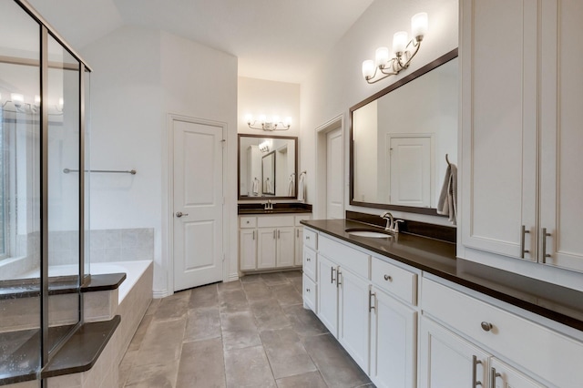 2464 Castle Ridge Dr, Richardson, TX 75080 - full bathroom with vanity, a bath, a stall shower, and a chandelier