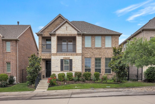 2464 Castle Ridge Dr, Richardson, TX 75080 - view of front of property featuring a balcony, stone siding, brick siding, and a shingled roof