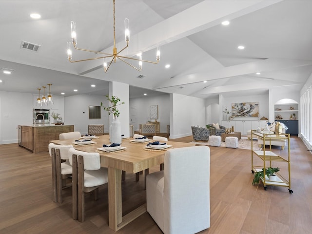 5832 Charlestown Dr, Dallas, TX 75230 - dining space featuring a chandelier, light wood-type flooring, recessed lighting, high vaulted ceiling, and built in features