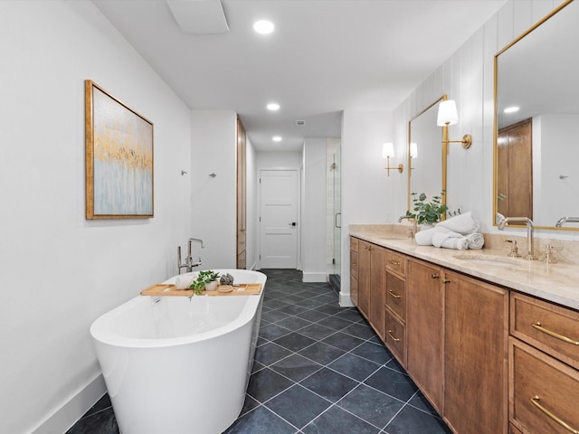 5832 Charlestown Dr, Dallas, TX 75230 - bathroom featuring a soaking tub, double vanity, a stall shower, recessed lighting, and tile patterned flooring