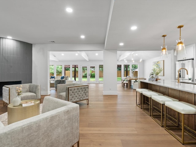 5832 Charlestown Dr, Dallas, TX 75230 - living area with light wood-type flooring, recessed lighting, and french doors