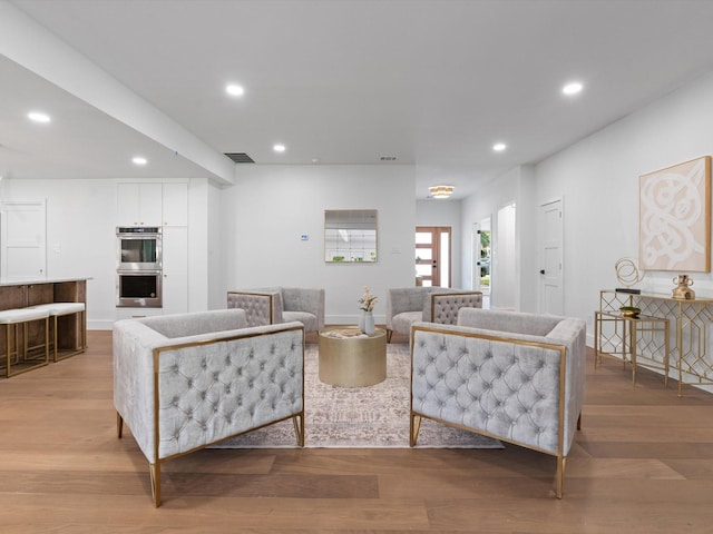 5832 Charlestown Dr, Dallas, TX 75230 - living room featuring light wood-style flooring and recessed lighting
