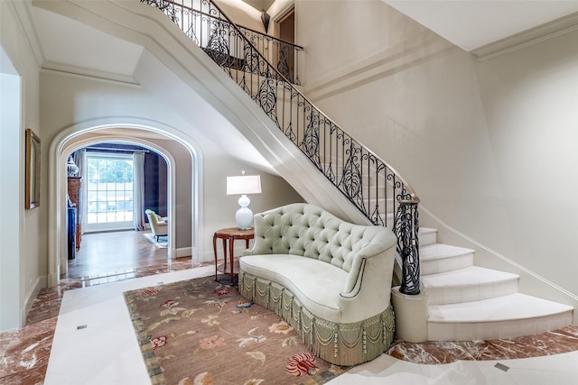 5800 Armstrong Pkwy, University Park, TX 75205 - staircase featuring arched walkways, ornamental molding, and a high ceiling
