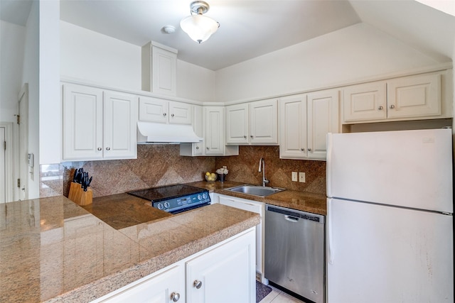 5800 Armstrong Pkwy, University Park, TX 75205 - kitchen featuring freestanding refrigerator, dishwasher, under cabinet range hood, tile countertops, and decorative backsplash